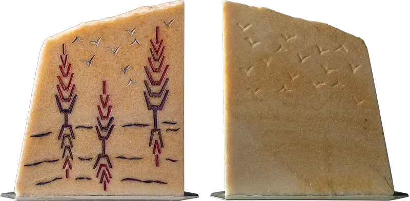 I.V., natural state — golden alabaster engraved on both sides, the artist's initials becoming trees and gulls