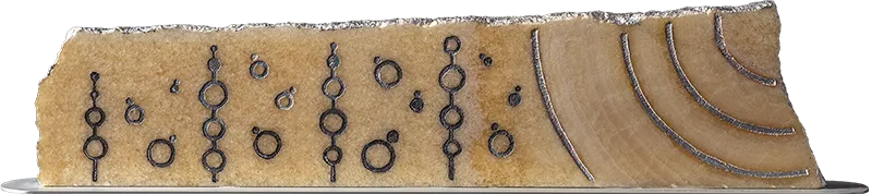 Congiunzioni Astrali, natural state — planetary conjunctions traced in silver leaf along the veins of golden alabaster, on aluminium base