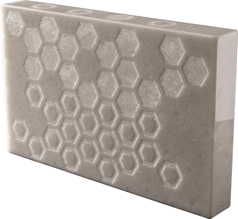 Where the Bee Sucks, natural state — hexagonal honeycomb pattern engraved in crystalline marble